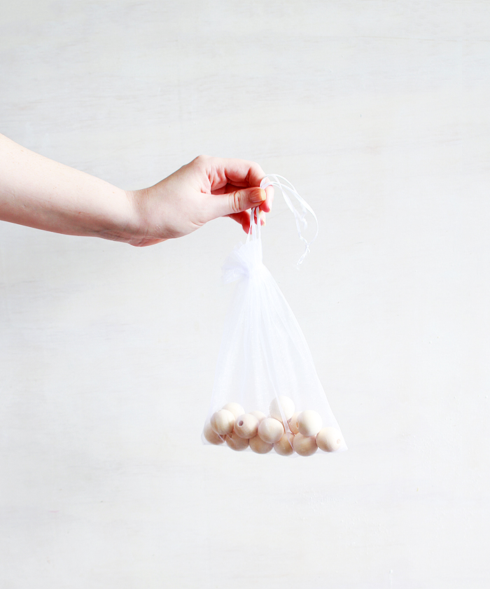 It only takes 5 minutes to make these simple wooden bead garlands! 